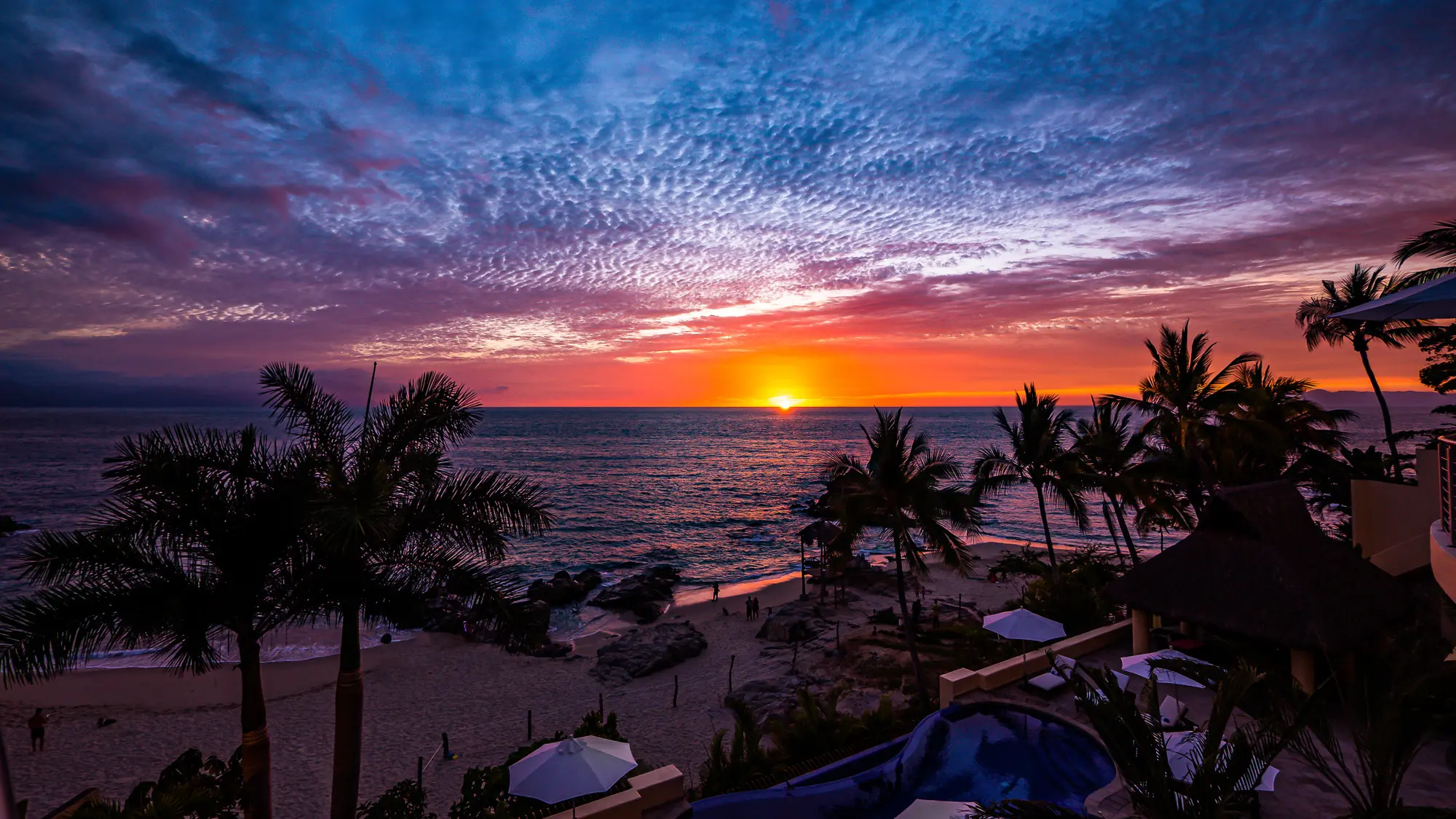 Sunset in Puerto Vallarta and infinity swimming pool with hot tub