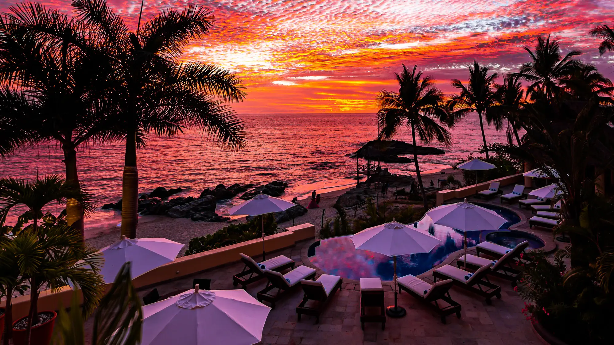 Sunset in Puerto Vallarta and infinity swimming pool with hot tub